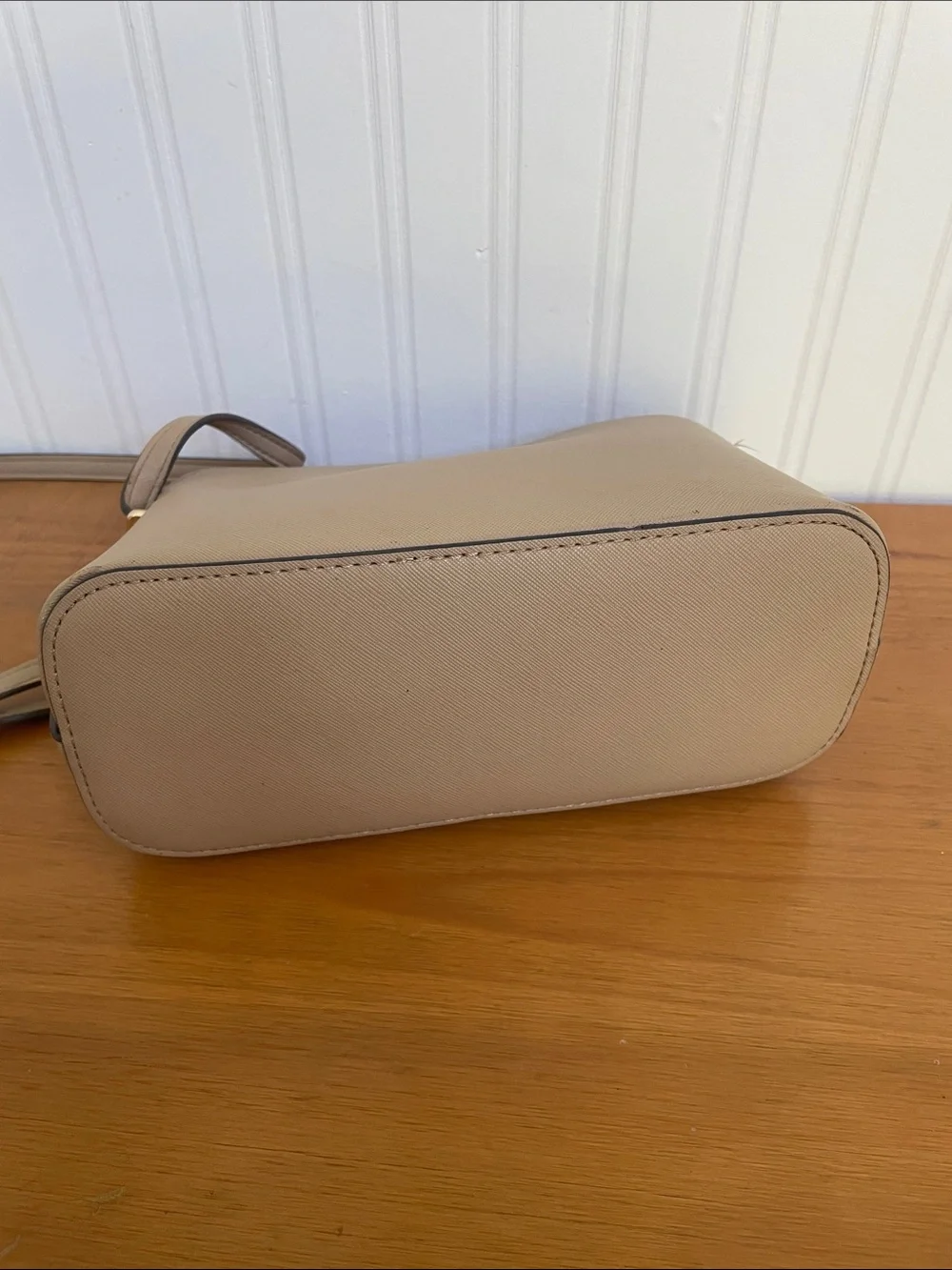 Kate Spade tan crossbody with floral, butterfly and fruit accents